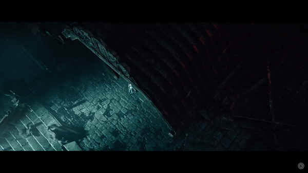 A picture of chapbooks and anthologies on a medium-brown wooden surface; the top book reads "Commutability" over a blurry, high-contrast photograph of the inside of a train station.